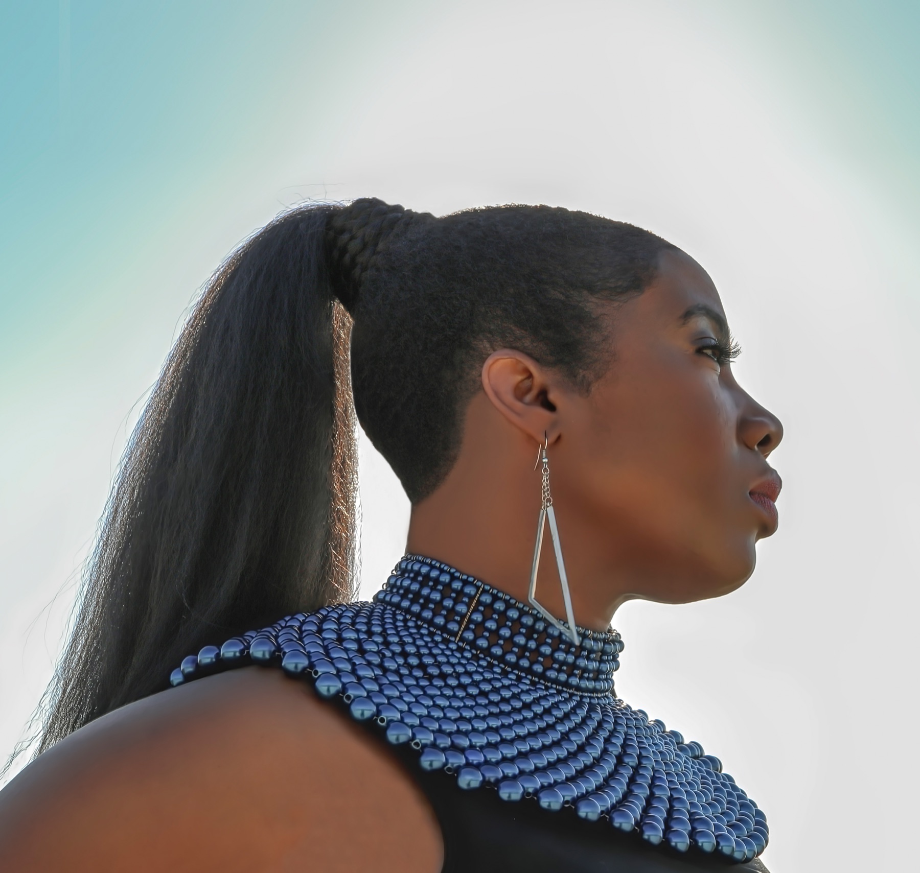 Tarrey Torae — portrait in blue beaded collar